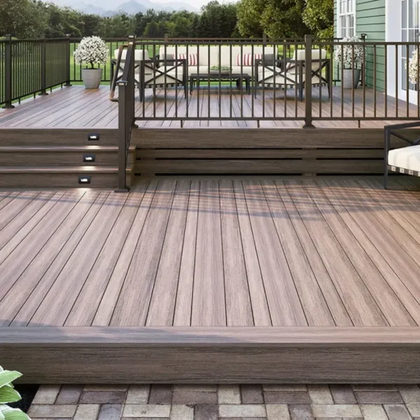 Modern composite deck with black railing, built-in lighting, and outdoor seating area.